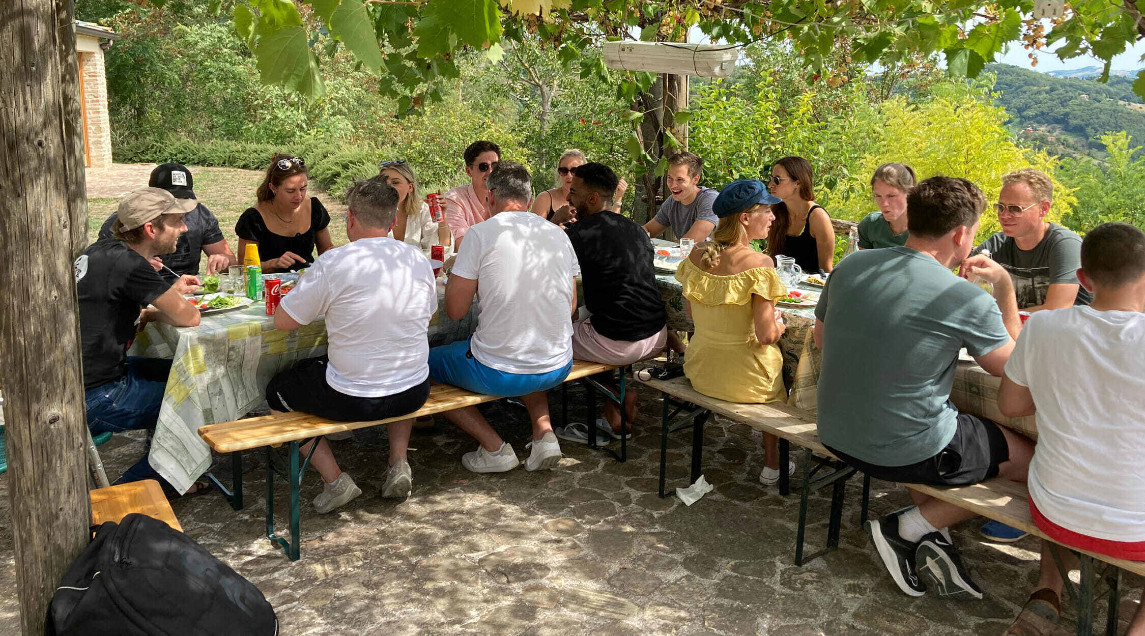 The team sit down to an alfresco lunch